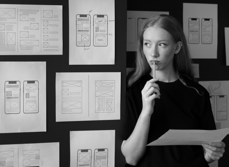 Image of a girl working on an Ember product strategy, researching market and defining product goals