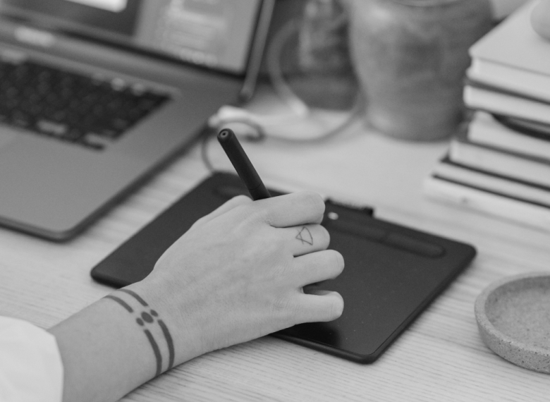 hand on a touch pad working on a user testing and functionalities